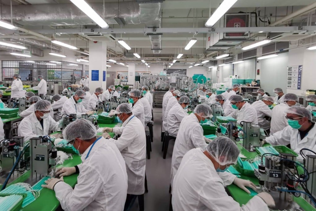 Volunteer officers from the Correctional Services Department produce masks at Lo Wu on February 7, 2020. Photo: Handout