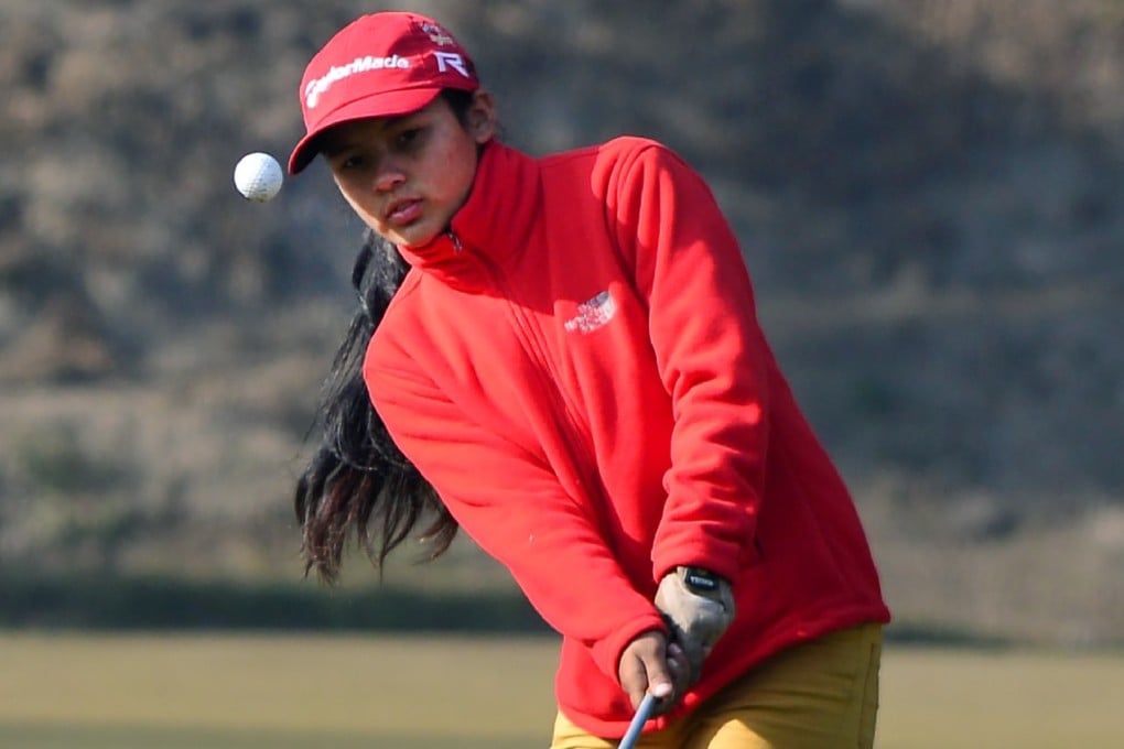 When Pratima Sherpa started playing golf as a child in Kathmandu, Nepal, she used a club made by her father from a tree branch. Now she is Nepal’s top female golfer and an inspiration to Tiger Woods. Photo: AFP