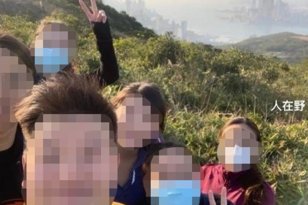 Another photo of the group showing them on a hillside with the sun setting at the back.