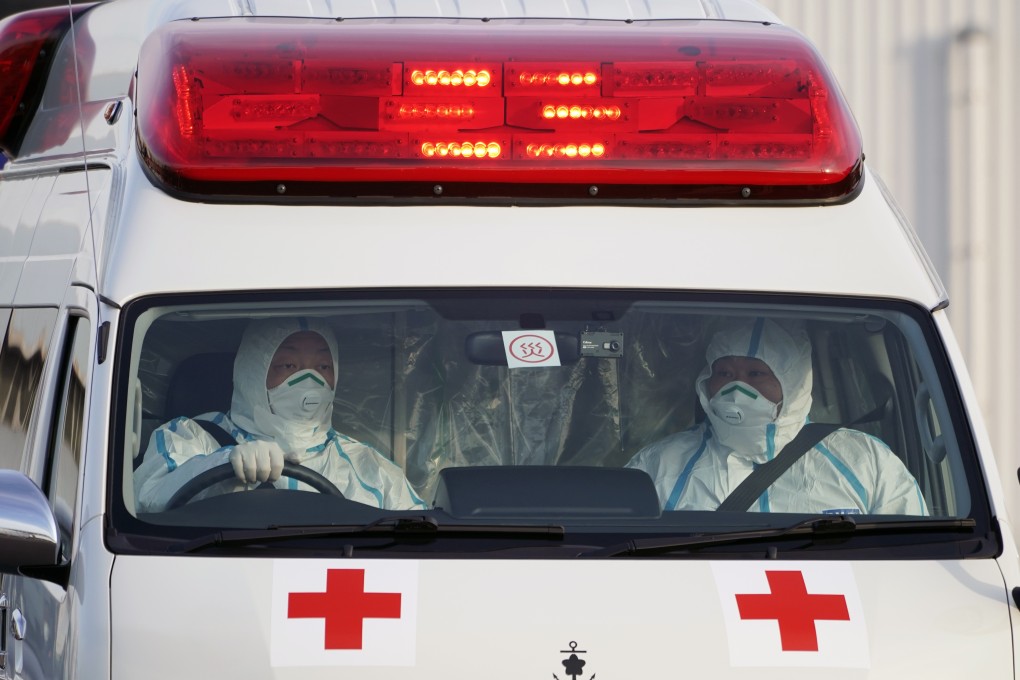 A Japanese ambulance believed to carry a passenger infected with the novel coronavirus leaves the pier where the Diamond Princess cruise ship is docked. Photo: EPA