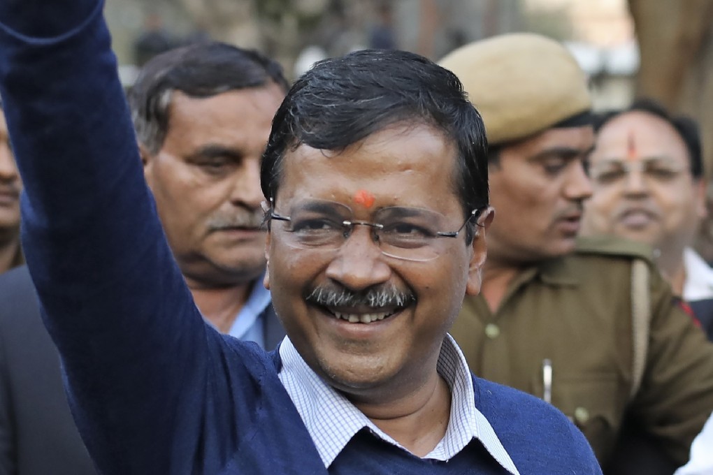New Delhi Chief Minister Arvind Kejriwal waves at supporters after a visit to a Hanuman temple following his AAP’s election victory. Photo: AP