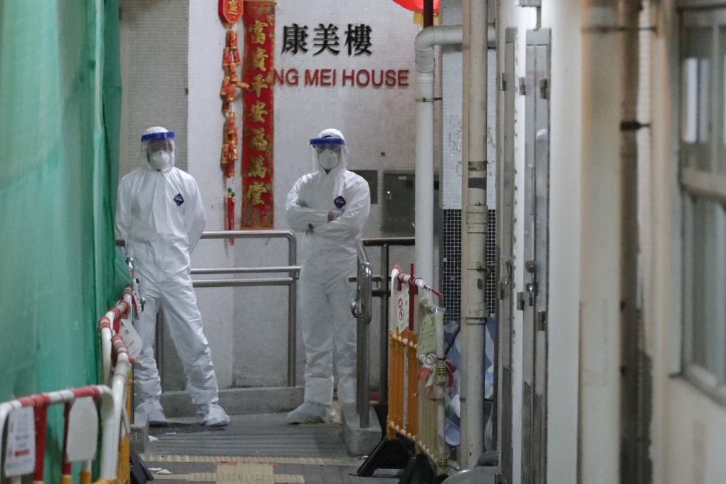Health workers at Hong Mei House in Tsing Yi after two people in the block were confirmed to have contracted the coronavirus. Photo: Edmond So