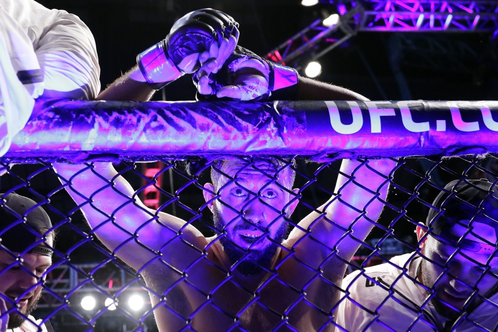 Dominick Reyes leans on the Octagon after losing to Jon Jones at UFC 247 on Sunday. Photo: AP