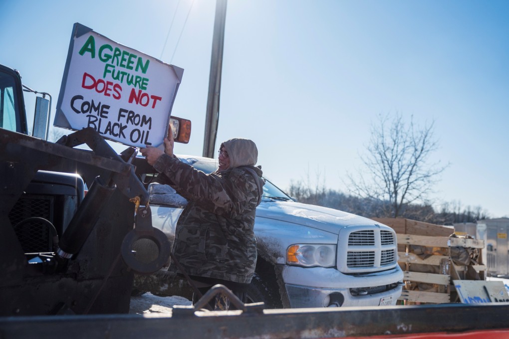 First Nations members of the Tyendinaga Mohawk Territory block train tracks servicing Via Rail, as part of a protest against the Coastal GasLink pipeline, in Belleville, Ontario, on Saturday. Photo: Reuters