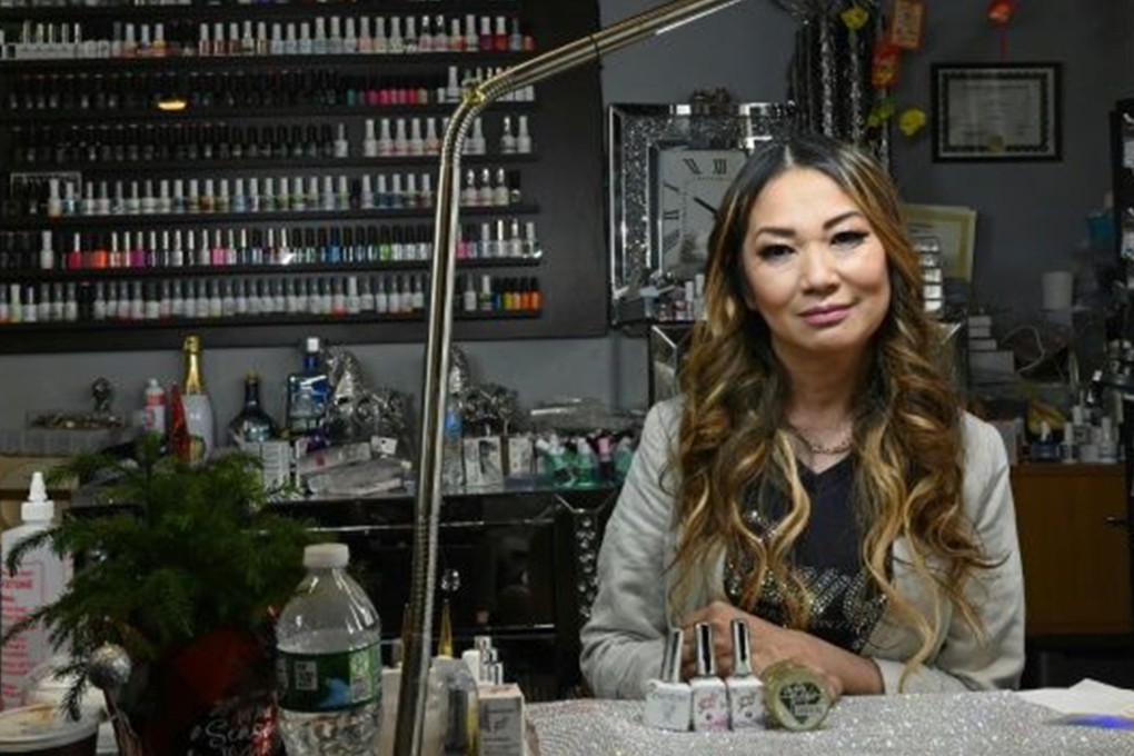 Nail artist Jenny Bui, also known as the “Queen of Bling”, at her nail salon in the Bronx, New York. Photo: AFP