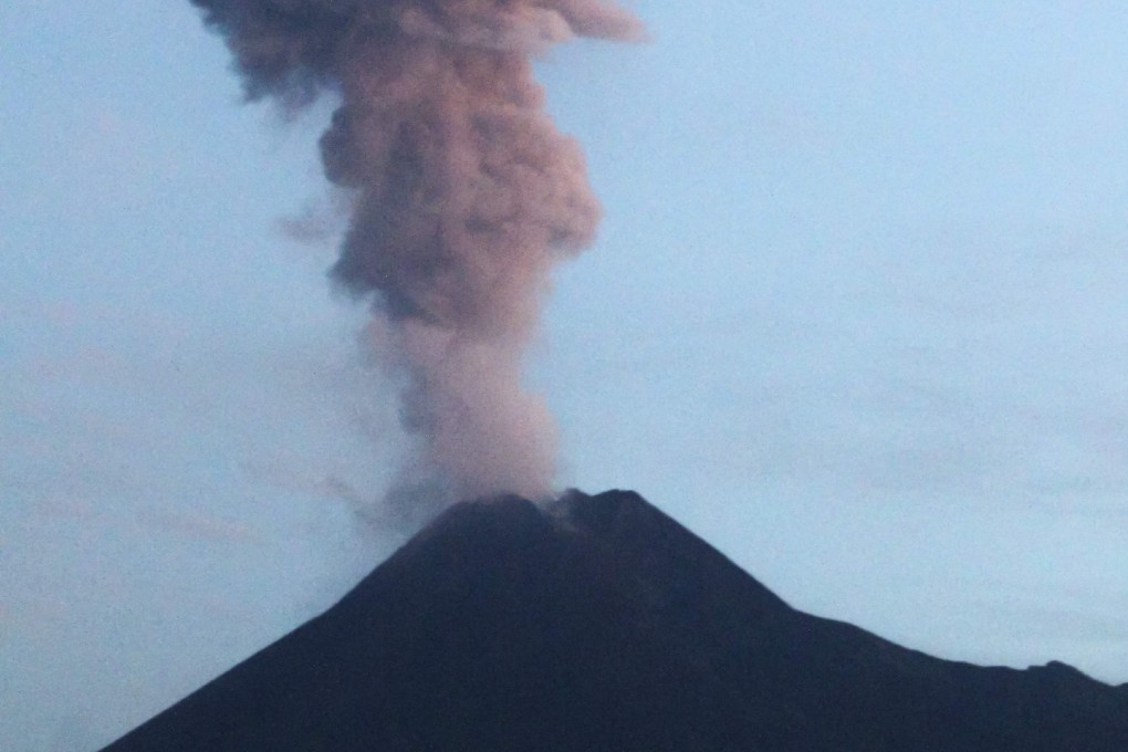 Ash spews from Mount Merapi during an eruption as seen from Yogyakarta in Indonesia on February 13. Photo: AFP