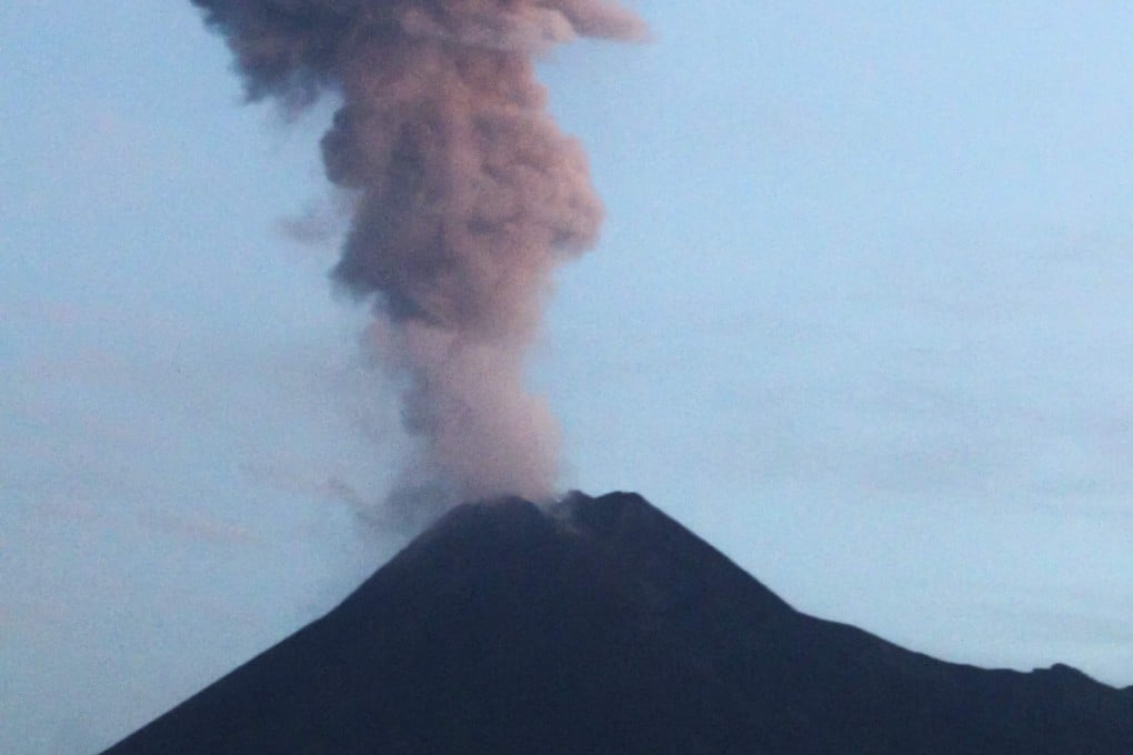 Ash spews from Mount Merapi during an eruption as seen from Yogyakarta in Indonesia on February 13. Photo: AFP