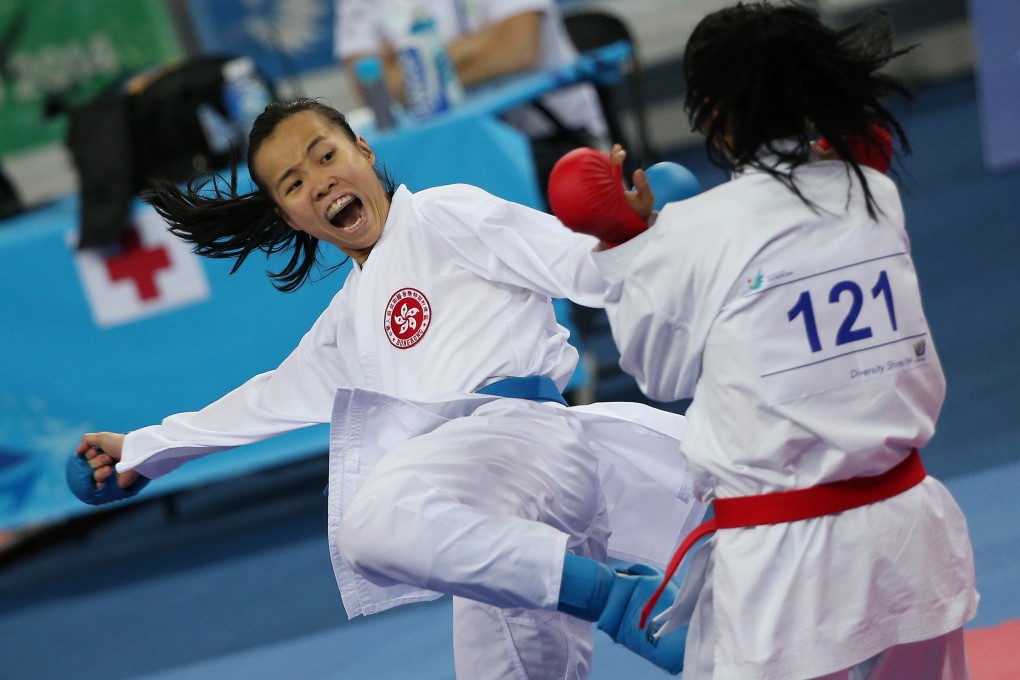 Hong Kong’s Jennifer Tsang (left) lands a blow on Dilnoza Bakirova of Uzbekistan during the kumite women’s 50kg final at Gyeyang Gymnasium in Incheon, South Korea.