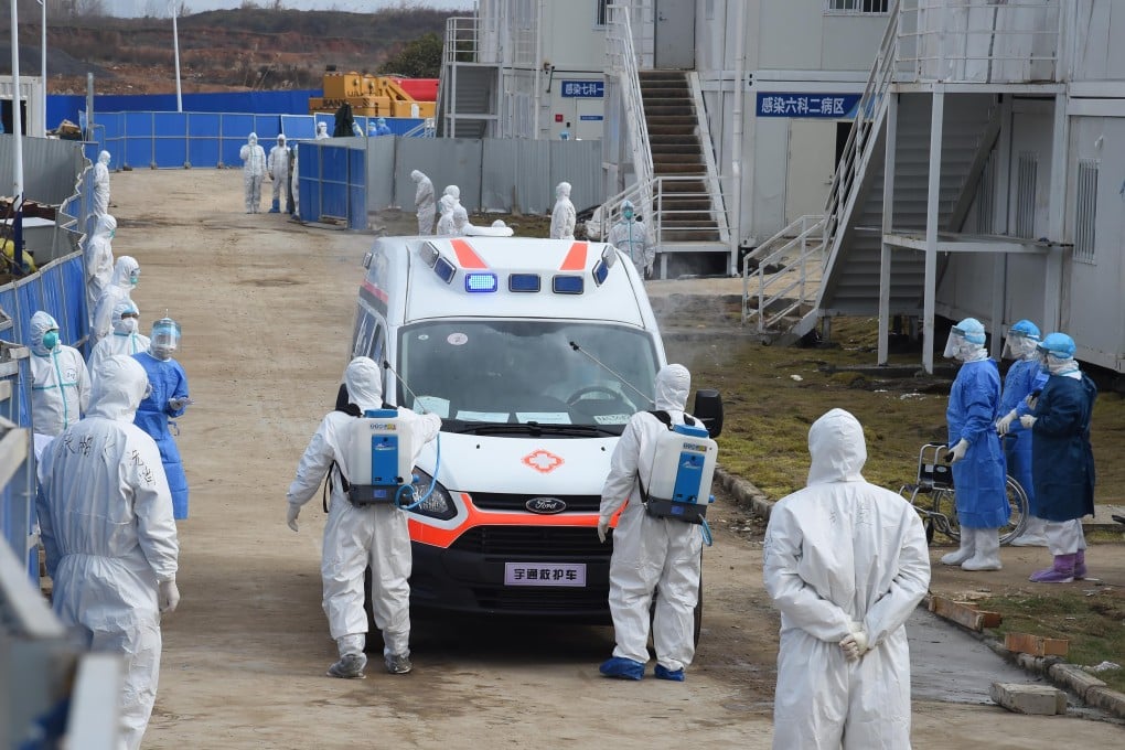 Medical workers disinfect an ambulance transferring infected patients at Wuhan’s Huoshenshan Hospital, a 1,000-bed facility built in 10 days. Photo: Xinhua