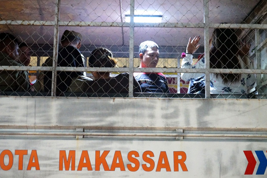 A group of people detained after a raid at a hotel in Makassar on February 13, 2020. Photo: AFP