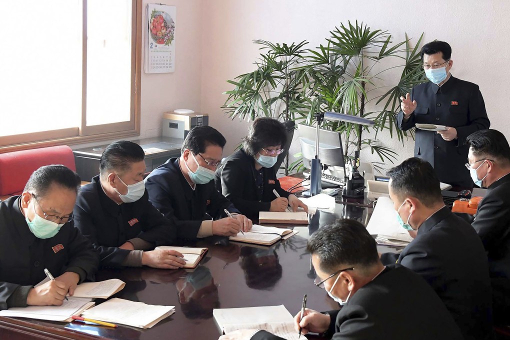 North Korean Premier Kim Jae-ryon (top right) has a meeting at the emergency anti-epidemic headquarters in Pyongyang. Korean Central News Agency/Korea News Service via AP