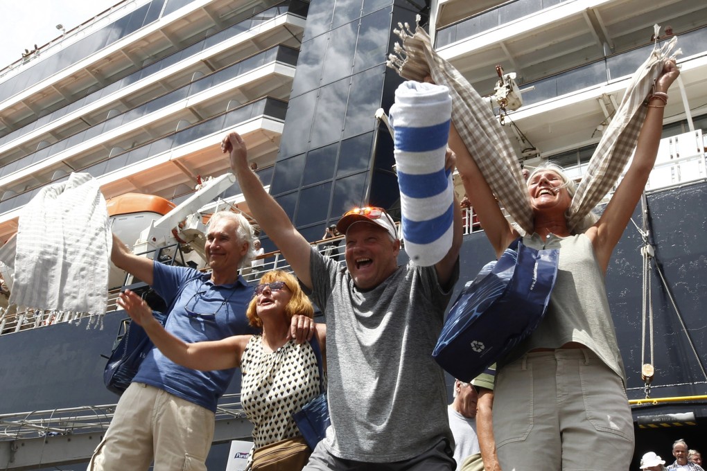 Passengers react after they disembark from the MS Westerdam on February 14, 2020. Photo: AP