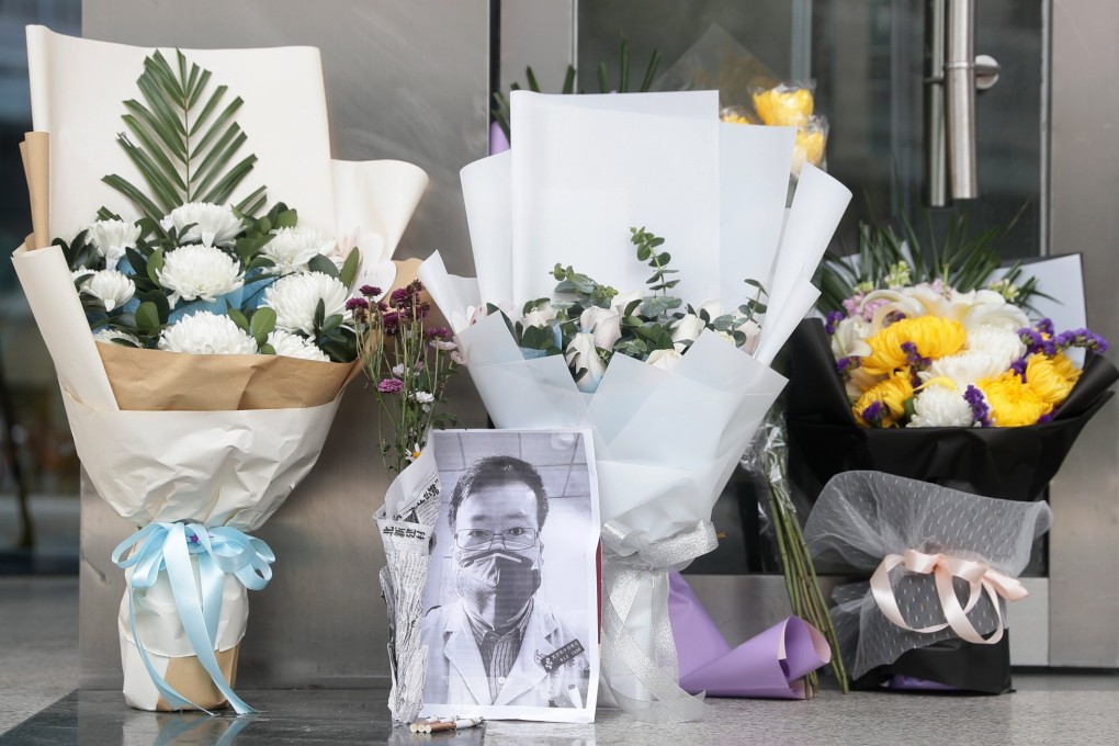 Tributes to Li Wenliang lie outside Wuhan Central Hospital in Wuhan, Hubei province, a day after his death. Photo: EPA-EFE