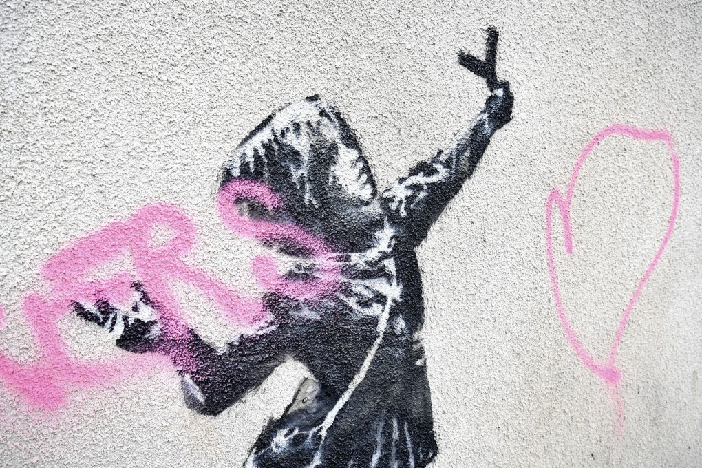 The mural by Bansky which has been vandalised. Photo: PA via AP