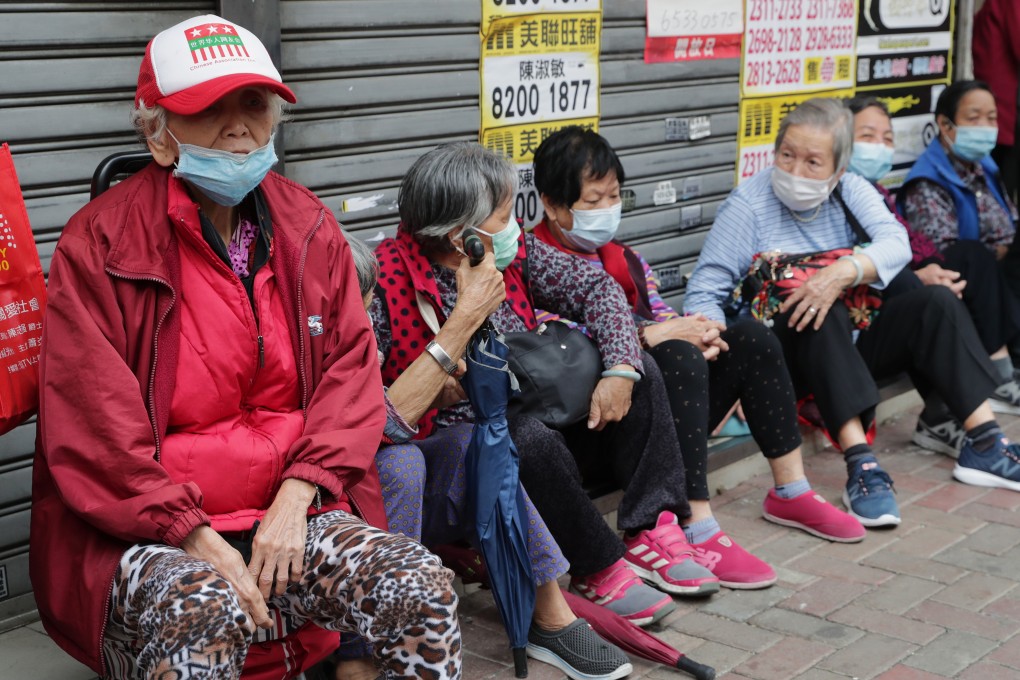 Elderly citizens queue for free surgical masks in Hong Kong’s Sham Shui Po neighbourhood. Photo: Edmond So