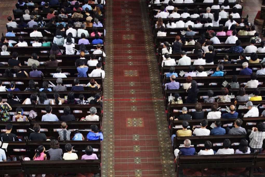 Crowds gather for a service at St. Joseph's Church in Singapore. Photo: Reuters
