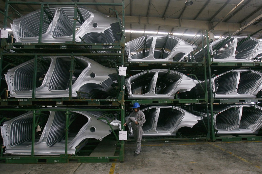 An employee checks Citroen C5 car components at the Dongfeng Peugeot Citroen Automobile factory in Wuhan, Hubei province. The coronavirus outbreak has hit production at all of Dongfeng’s plants in China. Photo: Reuters