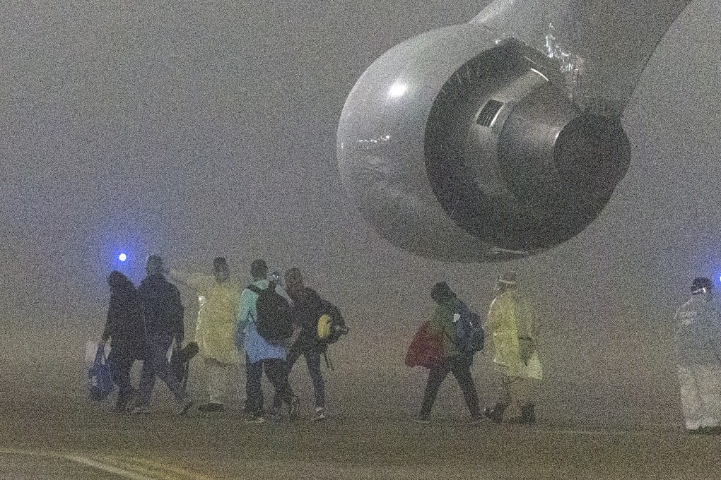 American passengers evacuated from the Diamond Princess in Japan disembark from a plane in San Antonio, Texas early on Monday. Photo: San Antonio Express-News via AP