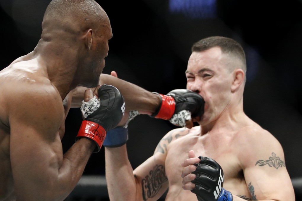 Kamaru Usman hits Colby Covington at UFC 245. Photo: AP