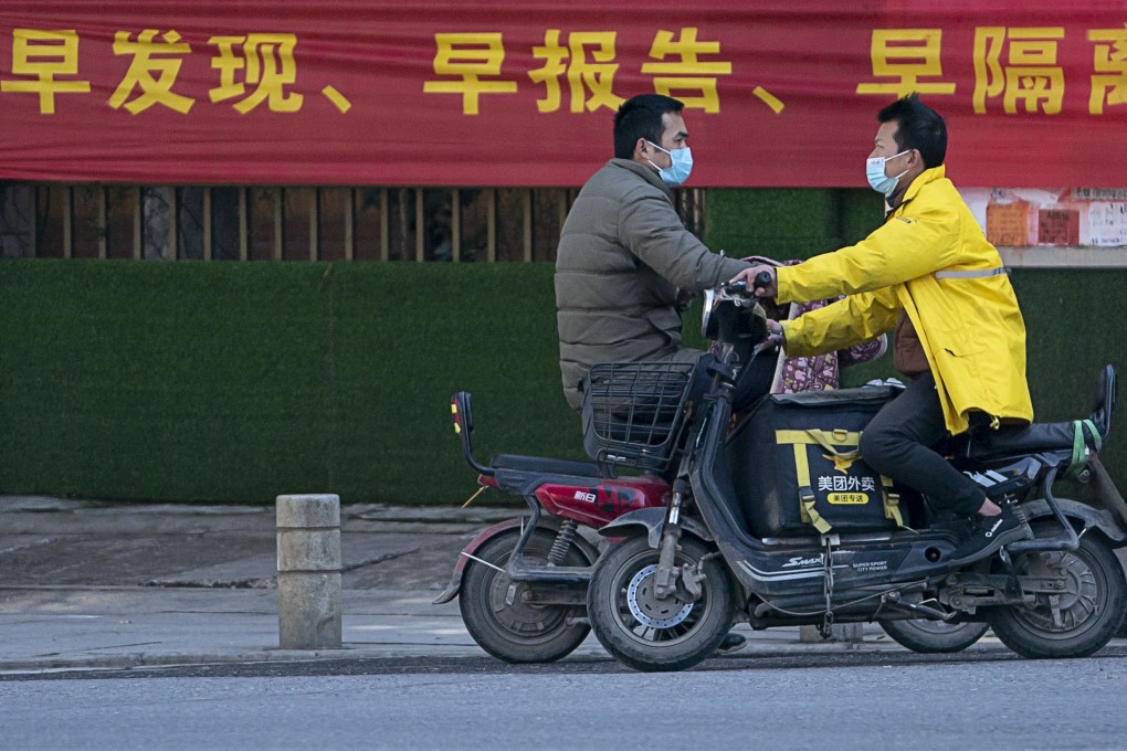 (200216) – WUHAN, Feb. 16, 2020 (Xinhua) – People ride scooters in a street in Wuhan, central China's Hubei Province, Feb. 16, 2020. Wuhan welcomed a sunny day on Sunday. (Xinhua/Xiong Qi)
