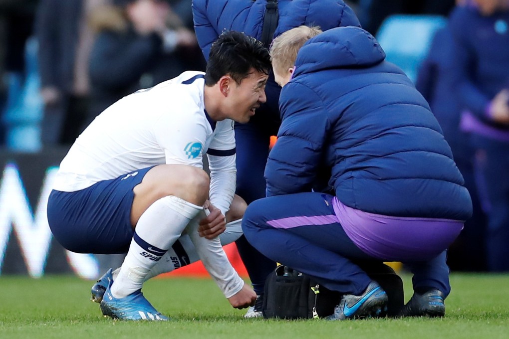Tottenham Hotspur's Son Heung-min gets treatment on his injured arm in the English Premier League game against Aston Villa. Photo: Reuters