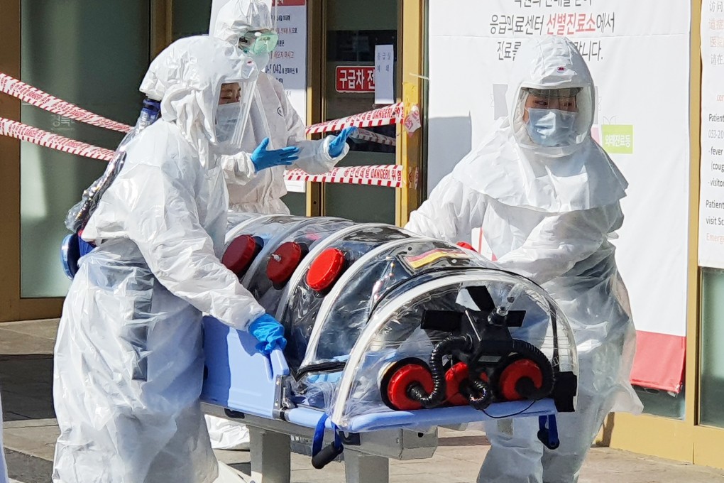 A patient suspected of carrying the new coronavirus arrives at Kyungpook National University Hospital in Daegu, South Korea. Photo: DPA