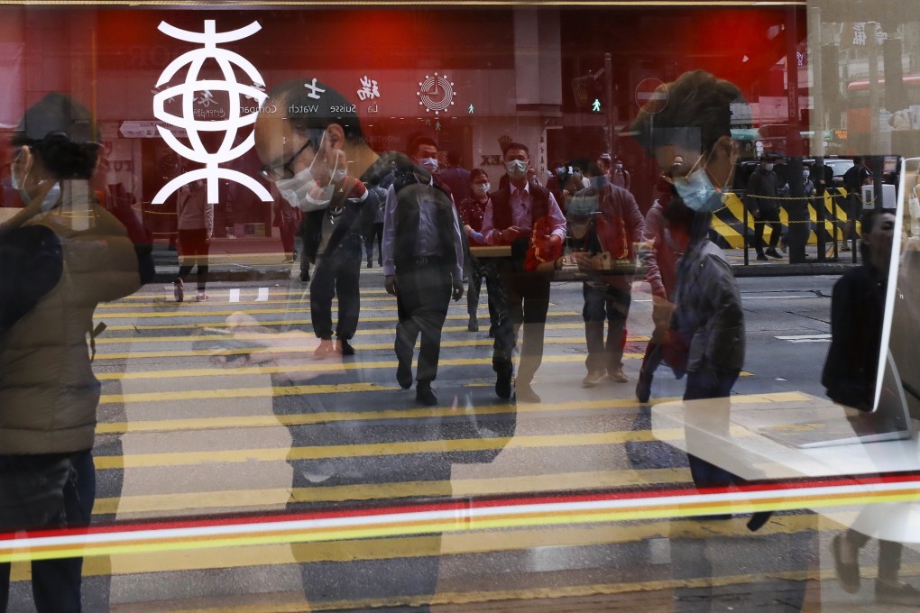 Customers at a Bank of East Asia branch in Mong Kok, Hong Kong. Photo: Nora Tam