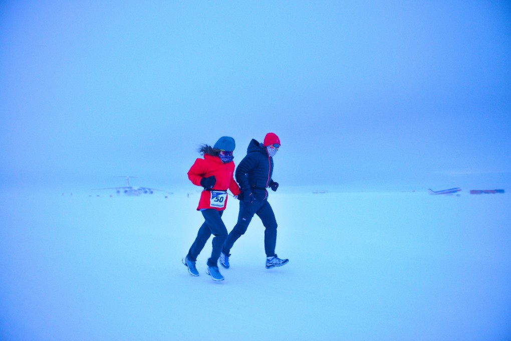 Andy Chik Wing-keung and his daughter Nicole run through brutal weather in Antarctica. Photos: Handout