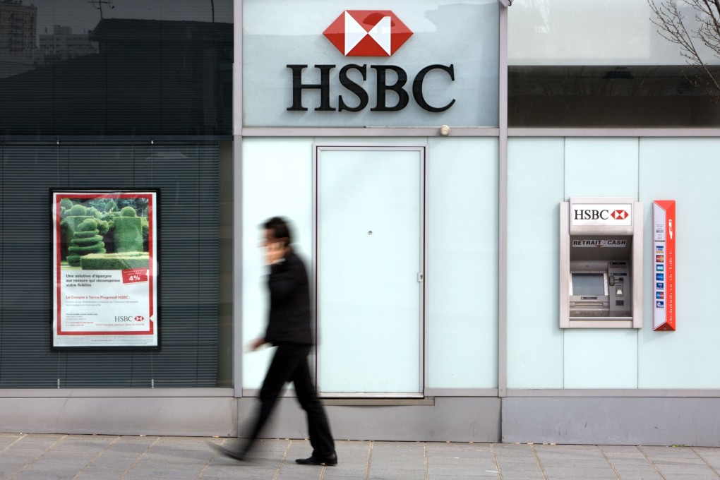 In this file photograph taken on March 24, 2010, a pedestrian walks past a branch of international banking firm HSBC in Paris. Photo: AFP