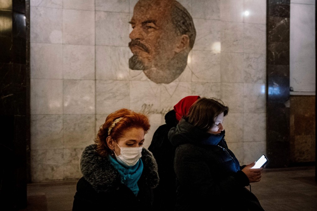 A woman wearing a face mask walks in a metro station in Moscow on February 7. Photo: AFP
