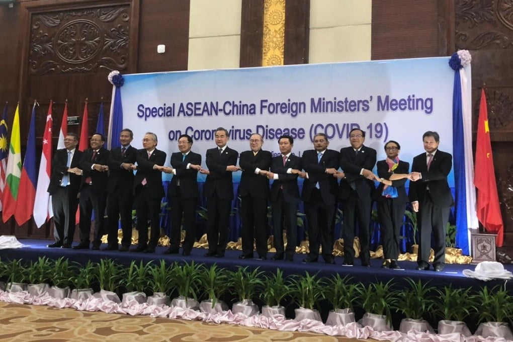 The foreign ministers of China and Asean member nations join hands at the start of the meeting in Vientiane, Laos, on February 20, 2020. Photo: Dewey Sim