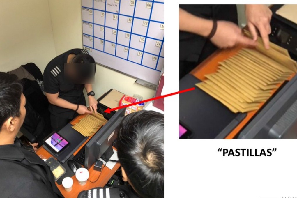 Officials at Manila’s airport preparing the alleged pastillas pay-offs. Photo: Handout