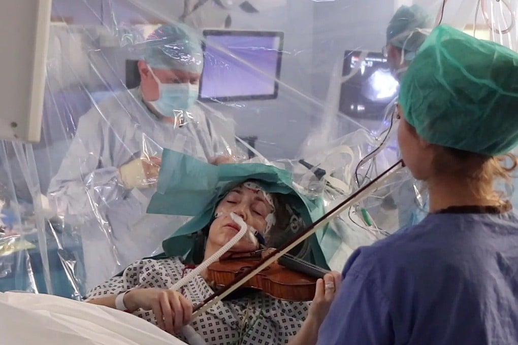 Dagmar Turner played her violin during the operation to remove a tumour from the right frontal lobe of her brain – close to the area that controls the fine movement of her left hand. Photo: AFP