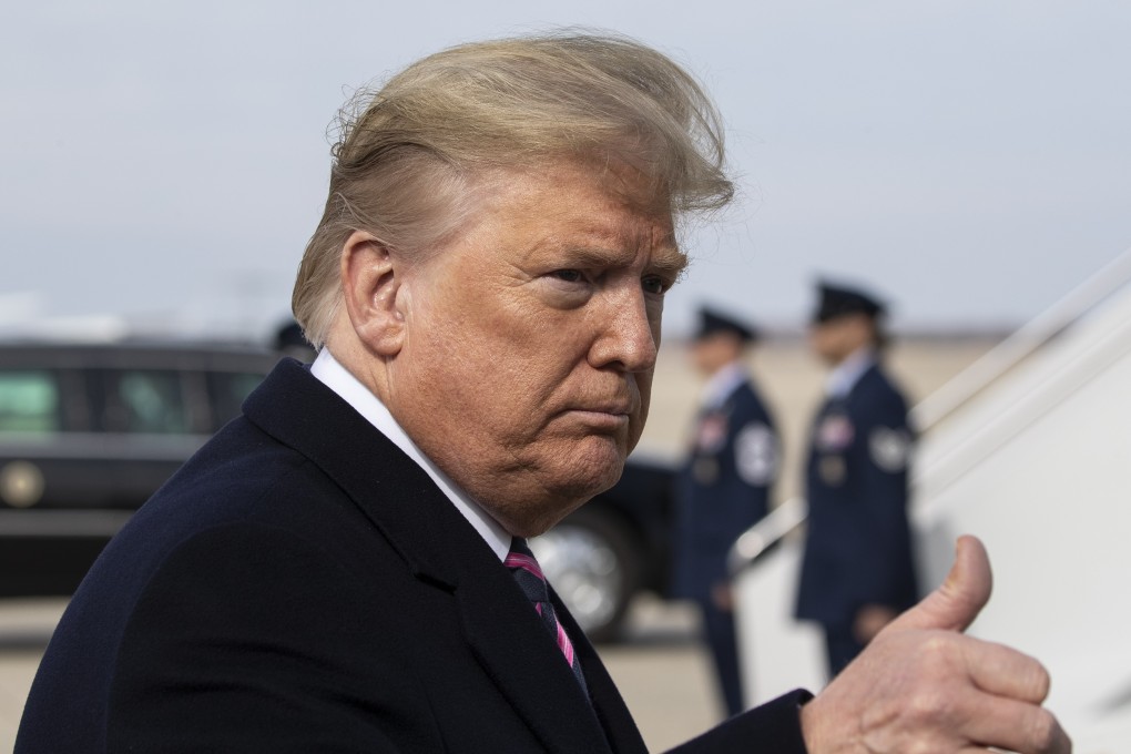 President Donald Trump gives thumbs up after speaking with the media as he boards Air Force One as he departs Tuesday, February 18, 2020, at Andrews Air Force Base. Photo: AP