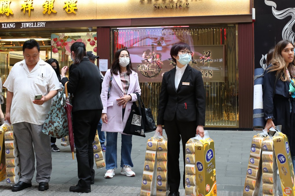 Shoppers seen with bags of toilet rolls in Causeway Bay amid the coronavirus outbreak. Photo: Xiaomei Chen
