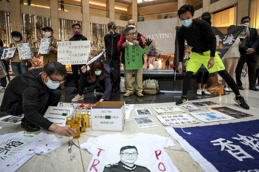 Anti-government protesters in Central celebrate a riot police officer’s contracting of the coronavirus at a protest called to mark the July 21 Yuen Long mob attack. Photo: Xiaomei Chen