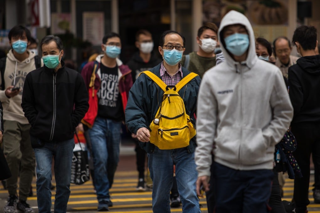 People wear face masks in Hong Kong, on February 9. Photo: AFP