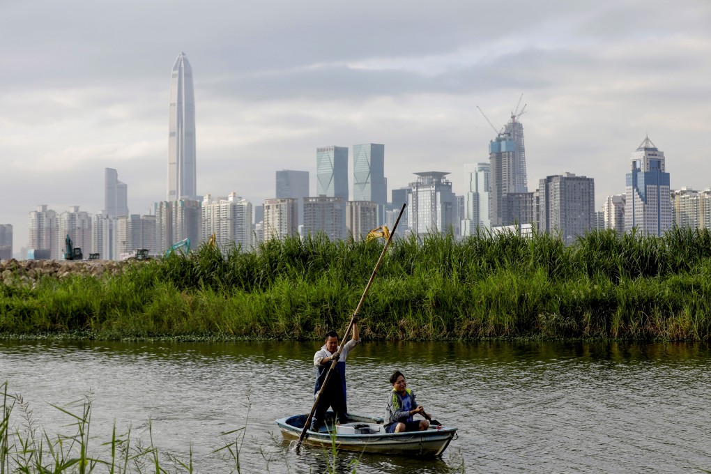 Hongkongers return from a fishing trip to their home in Lok Ma Chau in Hong Kong, with the Shenzhen skyline in the distance, on October 29, 2019. Photo: Reuters