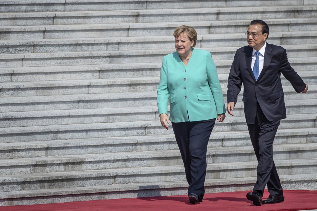 German Chancellor Angela Merkel (left) and Chinese Premier Li Keqiang meet in Beijing last year. Some observers say Merkel has been too keen to reach a deal with China. Photo: AP