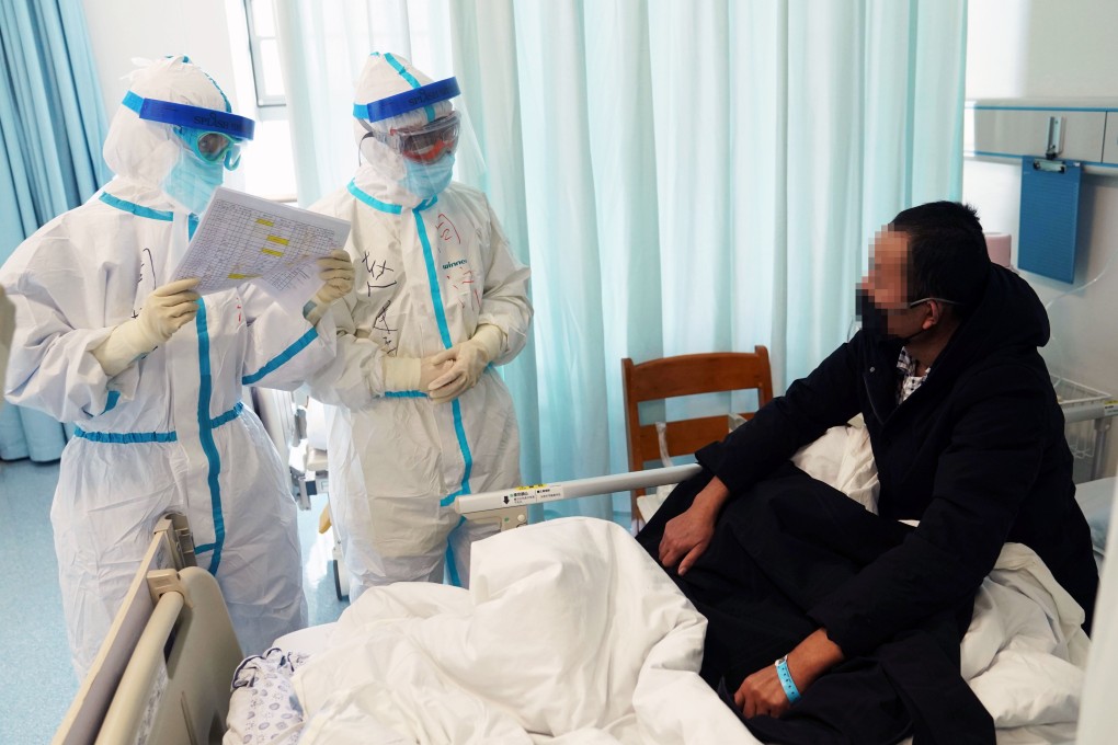 Respiratory and critical care specialists check up on a patient at Wuhan’s Tongji Hospital. Photo: Xinhua
