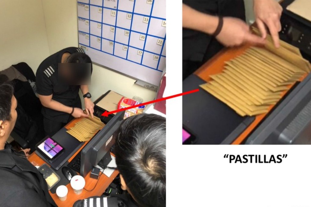 Officials at Manila’s airport preparing the alleged pastillas pay-offs. Photo: Handout