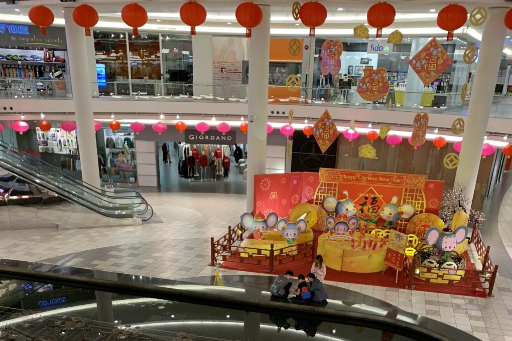 The near-deserted central forum of the Aberdeen Centre shopping centre in Richmond, British Columbia, at about 6pm on a recent Saturday, more than two hours before closing time. Trade at the once-bustling mall has slumped amid coronavirus fears. Photo: Ian Young
