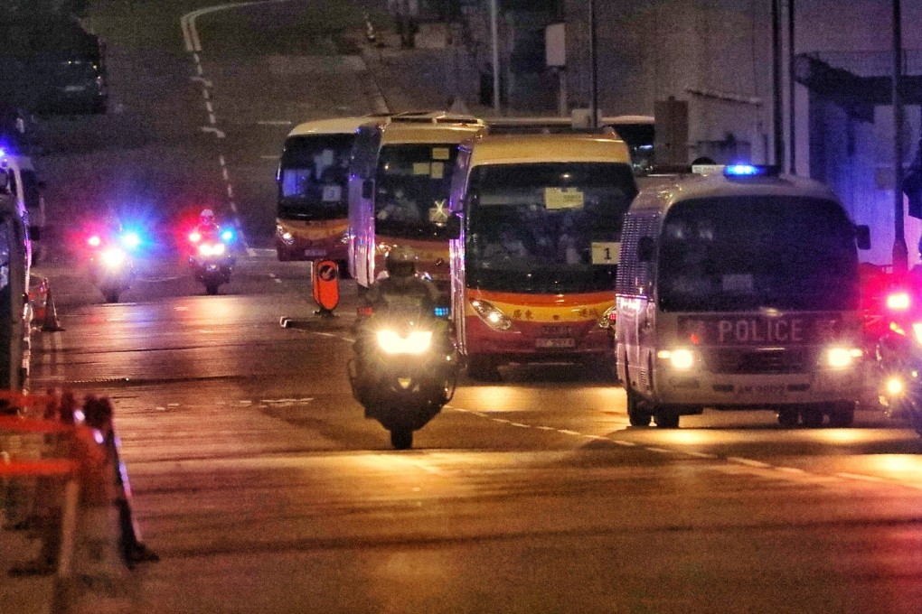 Hong Kong passengers of the Diamond Princess cruise ship arrive for quarantine at Chun Yeung Estate, Fo Tan, on Saturday. Photo: Felix Wong