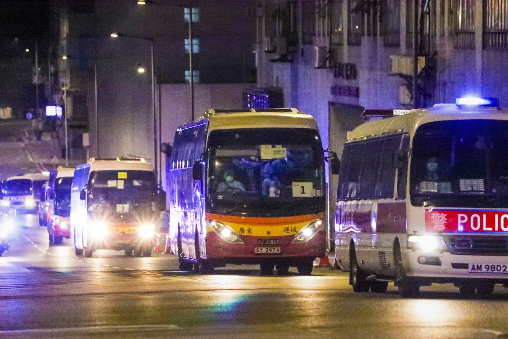 Buses carrying passengers from the Diamond Princess cruise arrive at Chun Yeung Estate in Fo Tan on February 22. SCMP/ Felix Wong