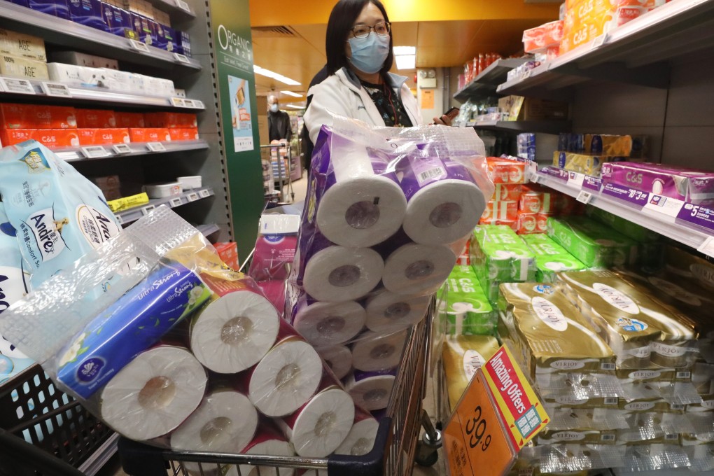 One shoppers gets her fill of toilet paper at a supermarket in Wan Chai. Photo: Nora Tam