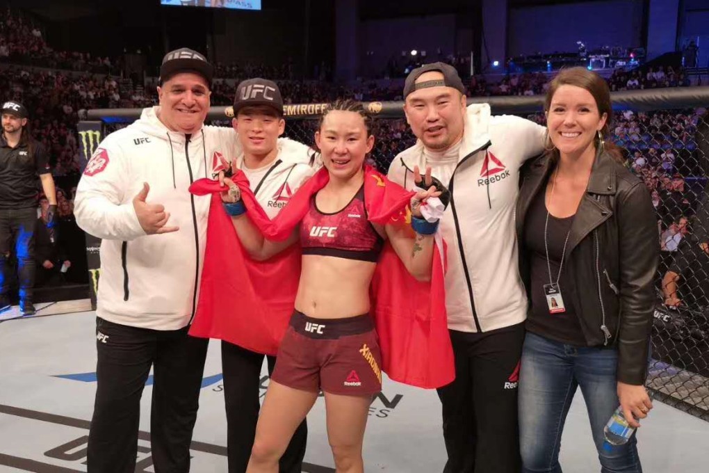 Yan Xiaonan celebrates her victory with her team. Photo: China Top Team/WeChat