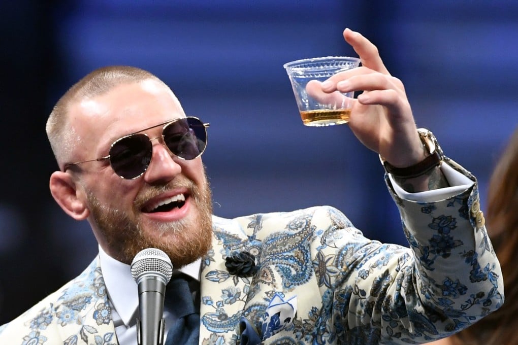 Conor McGregor celebrates his loss to Floyd Mayweather with a dram of his own branded whiskey in Las Vegas. Photo: Getty Images