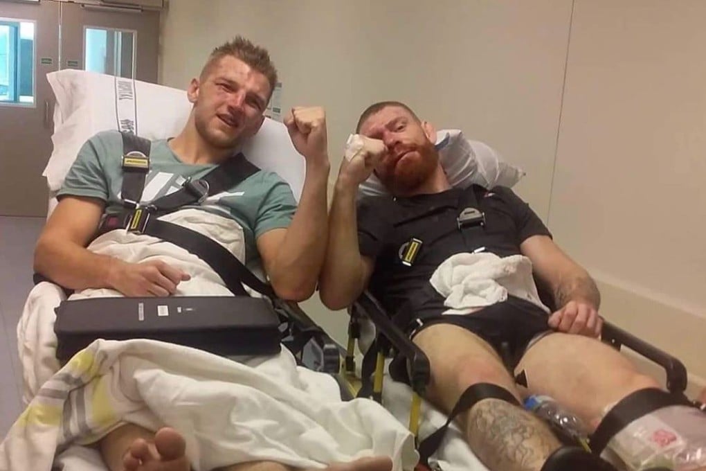 Dan Hooker and Paul Felder pose for a picture together on stretchers. Photo: Instagram