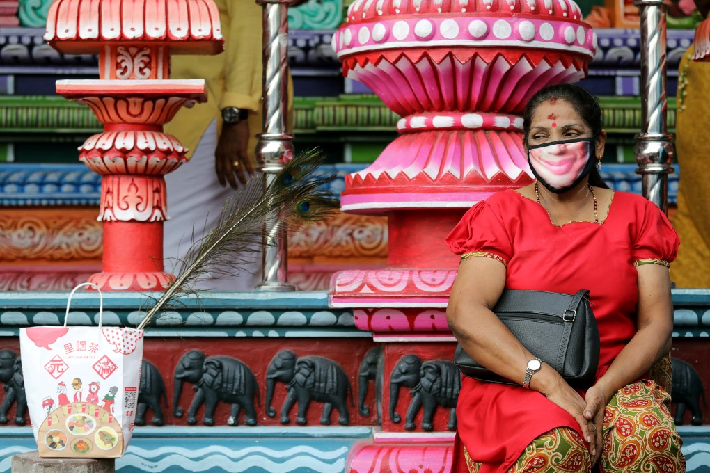 A visitor to the Batu Caves in Kuala Lumpur, Malaysia. Photo: Reuters