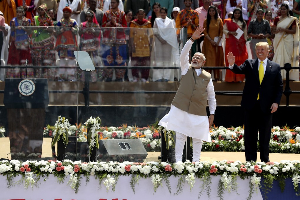 Indian Prime Minister Narendra Modi and US President Donald Trump wave to the crowd at Sardar Patel Stadium in Ahmedabad. Photo: AP